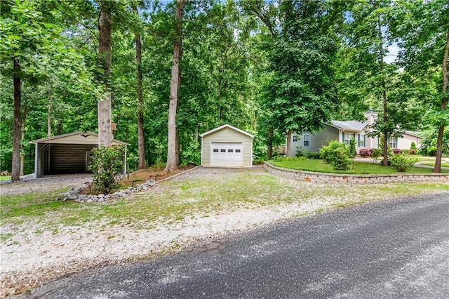 24 Arrow Ct, Lavonia, GA 30553 - view of front of property featuring an outdoor structure, driveway, a garage, a front lawn, and a carport