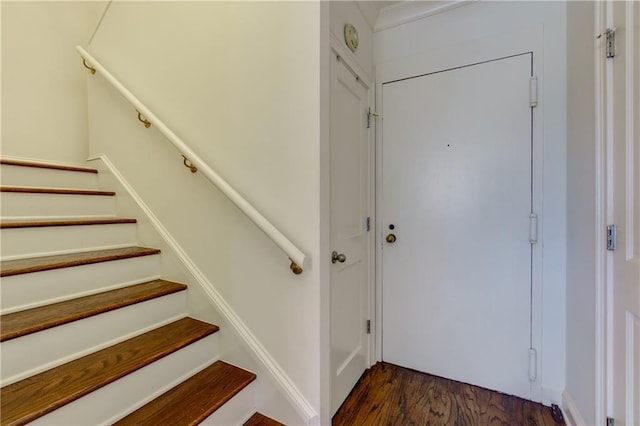 stairs with wood finished floors