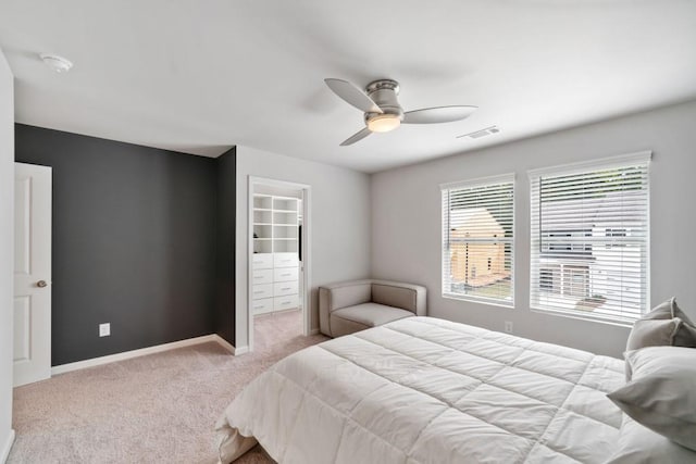 bedroom with ceiling fan and light colored carpet