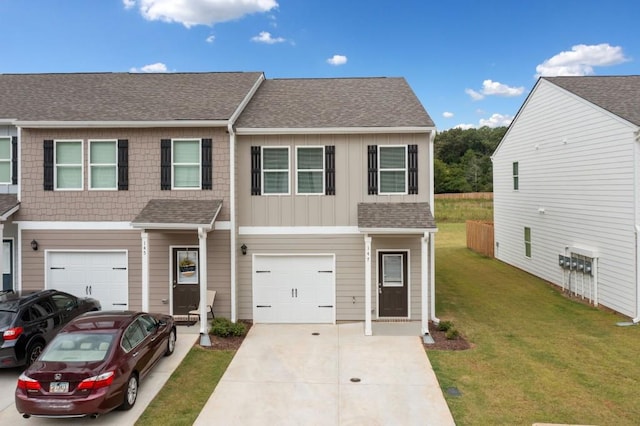 view of front of property featuring a garage and a front lawn