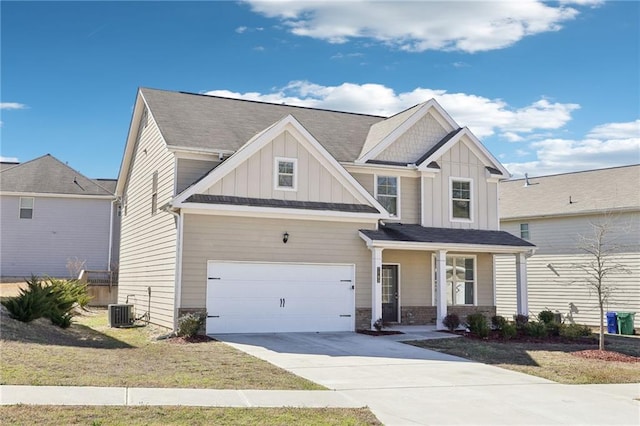 craftsman-style home featuring driveway, a porch, a garage, central air condition unit, and board and batten siding