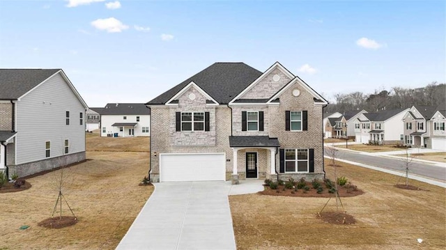 view of front facade with a front yard and a garage