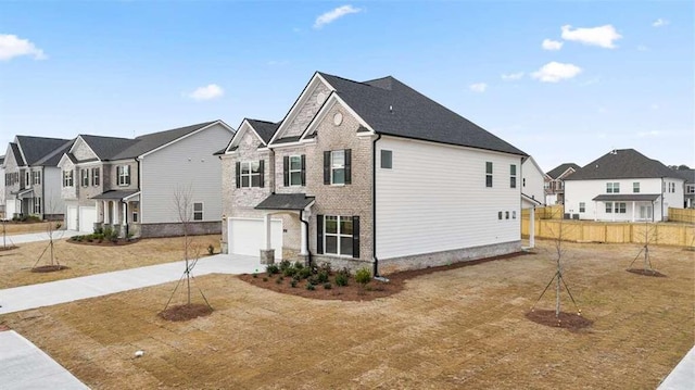 view of side of property featuring a yard and a garage