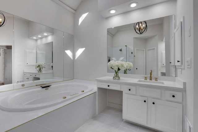 bathroom with a chandelier, vanity, marble finish floor, a bath, and a stall shower