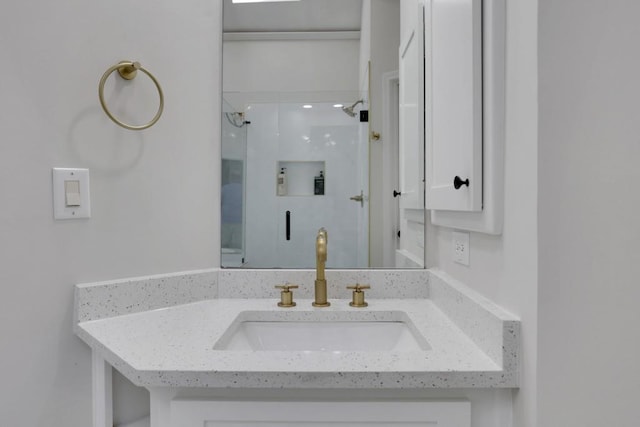 full bath featuring a shower and vanity