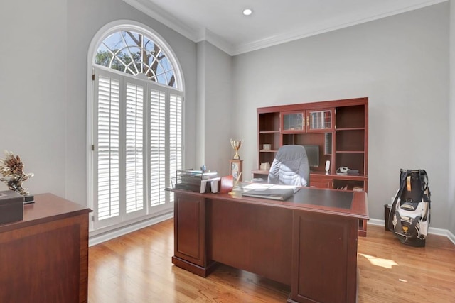 office space featuring baseboards, recessed lighting, light wood-type flooring, and crown molding