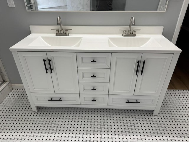 full bath featuring double vanity and a sink