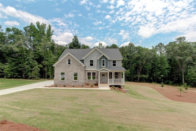 view of front of house with a porch and a front yard