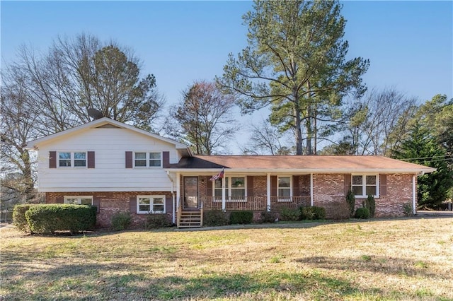 view of front of house with a porch and a front yard