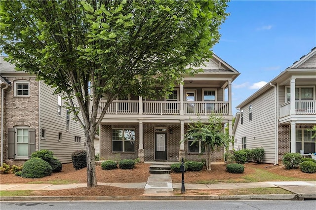 559 Myrle Trace Ln, Suwanee, GA 30024 - view of front of home with a balcony and brick siding