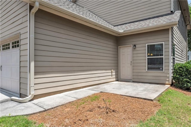 559 Myrle Trace Ln, Suwanee, GA 30024 - property entrance with roof with shingles and a patio