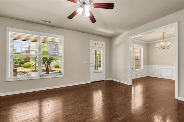 559 Myrle Trace Ln, Suwanee, GA 30024 - empty room with a chandelier, hardwood / wood-style floors, a ceiling fan, wainscoting, and baseboards