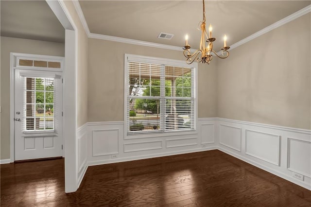 559 Myrle Trace Ln, Suwanee, GA 30024 - unfurnished dining area featuring a chandelier, dark wood finished floors, crown molding, and a wainscoted wall