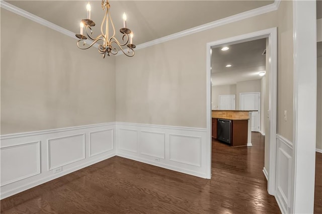 559 Myrle Trace Ln, Suwanee, GA 30024 - unfurnished dining area featuring a chandelier, ornamental molding, dark wood-type flooring, and wainscoting