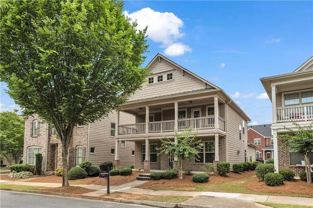 559 Myrle Trace Ln, Suwanee, GA 30024 - view of front of property with a balcony and brick siding