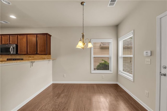 559 Myrle Trace Ln, Suwanee, GA 30024 - unfurnished dining area with dark wood-style flooring, a chandelier, baseboards, and recessed lighting