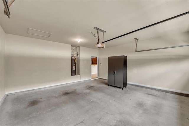559 Myrle Trace Ln, Suwanee, GA 30024 - garage with a garage door opener, water heater, and baseboards
