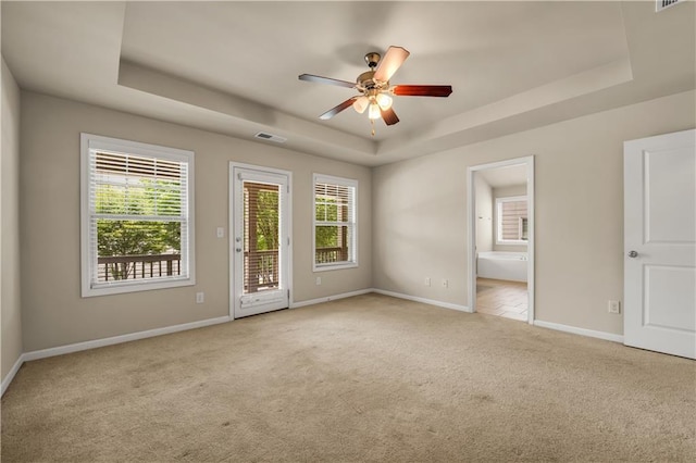 559 Myrle Trace Ln, Suwanee, GA 30024 - carpeted spare room featuring a raised ceiling, baseboards, and ceiling fan