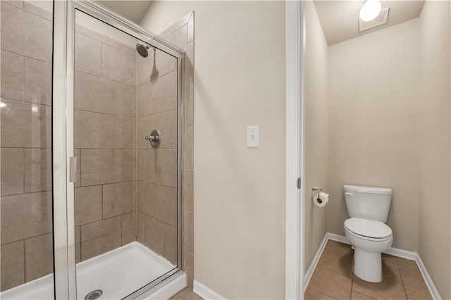 559 Myrle Trace Ln, Suwanee, GA 30024 - full bath with a shower stall, toilet, tile patterned flooring, and baseboards