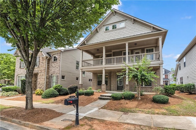 559 Myrle Trace Ln, Suwanee, GA 30024 - view of front of property with a balcony, a porch, and brick siding