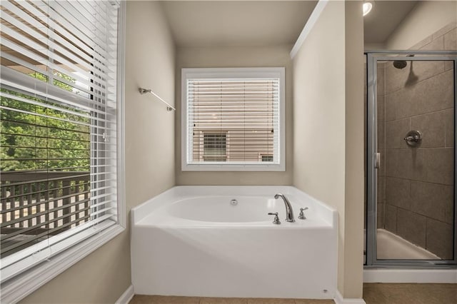 559 Myrle Trace Ln, Suwanee, GA 30024 - full bathroom with a garden tub, a stall shower, baseboards, and tile patterned floors