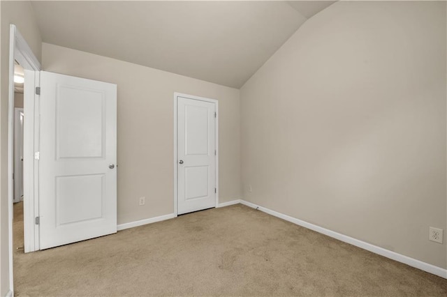 559 Myrle Trace Ln, Suwanee, GA 30024 - unfurnished bedroom with carpet, vaulted ceiling, and baseboards
