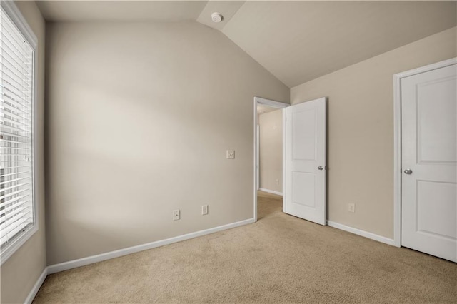 559 Myrle Trace Ln, Suwanee, GA 30024 - unfurnished bedroom featuring carpet flooring, lofted ceiling, and baseboards