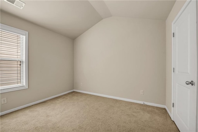 559 Myrle Trace Ln, Suwanee, GA 30024 - spare room featuring carpet flooring, vaulted ceiling, baseboards, and plenty of natural light