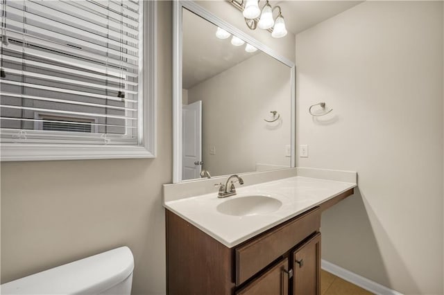 559 Myrle Trace Ln, Suwanee, GA 30024 - half bathroom featuring vanity, toilet, and tile patterned floors