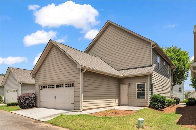 559 Myrle Trace Ln, Suwanee, GA 30024 - view of front of property featuring a garage, driveway, roof with shingles, and a front yard