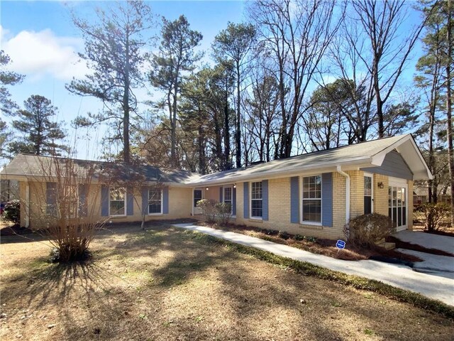 8005 Bamby Ln, Jonesboro, GA 30236 - ranch-style house with brick siding and a front lawn