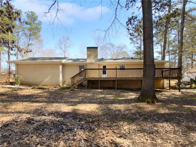 8005 Bamby Ln, Jonesboro, GA 30236 - rear view of property with stairs, a chimney, and a wooden deck