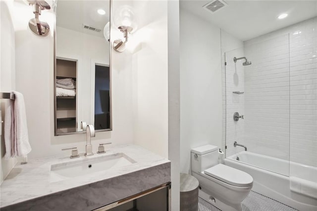 full bathroom with tiled shower / bath combo, vanity, and toilet