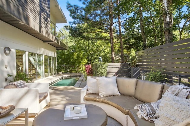 view of patio / terrace featuring outdoor lounge area and a balcony