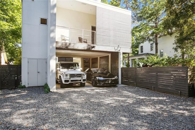 back of house with a balcony