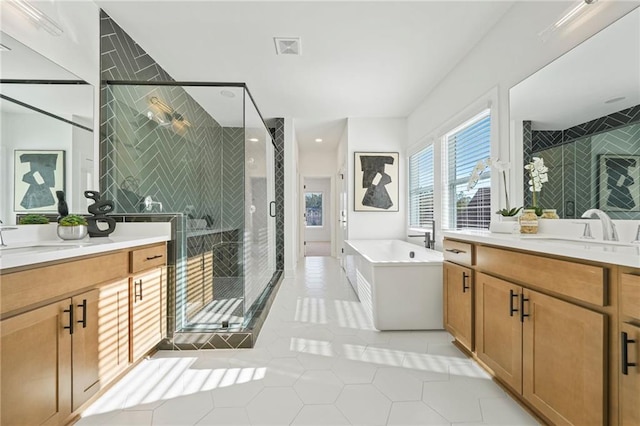 bathroom featuring vanity, tile patterned floors, and independent shower and bath