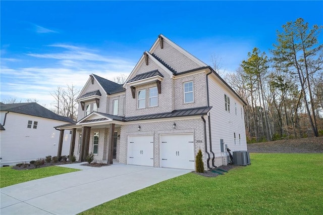 view of front facade with a garage, central AC, and a front yard