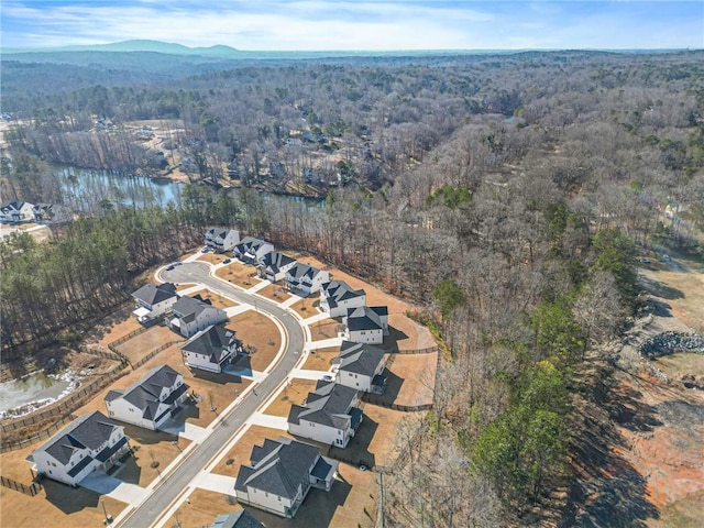 aerial view featuring a wooded view