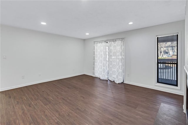 unfurnished room featuring dark hardwood / wood-style flooring