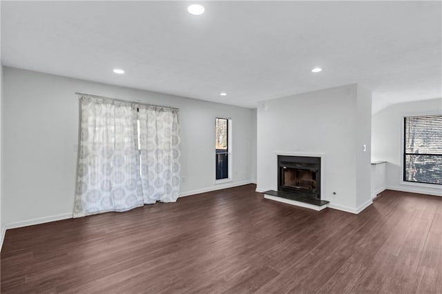 unfurnished living room featuring dark hardwood / wood-style flooring