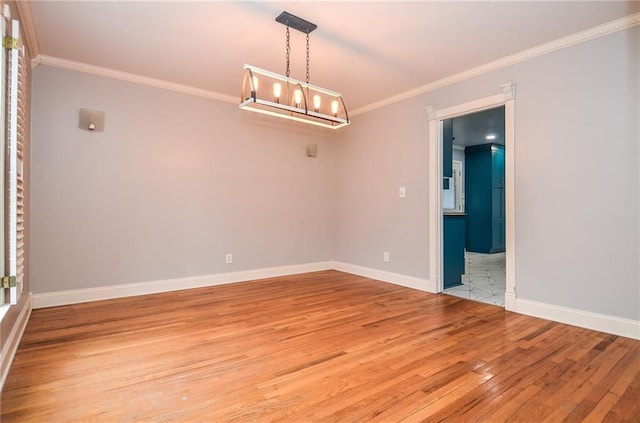 970 Winding Creek Trl, Sandy Springs, GA 30328 - unfurnished room featuring light wood-type flooring, ornamental molding, and a chandelier