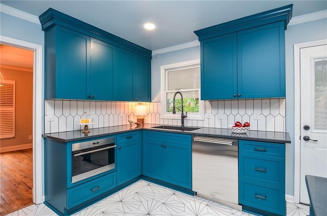 970 Winding Creek Trl, Sandy Springs, GA 30328 - kitchen with stainless steel appliances, dark countertops, ornamental molding, blue cabinetry, and decorative backsplash