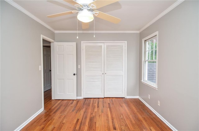 970 Winding Creek Trl, Sandy Springs, GA 30328 - unfurnished bedroom featuring light wood-type flooring, ornamental molding, a closet, and a ceiling fan