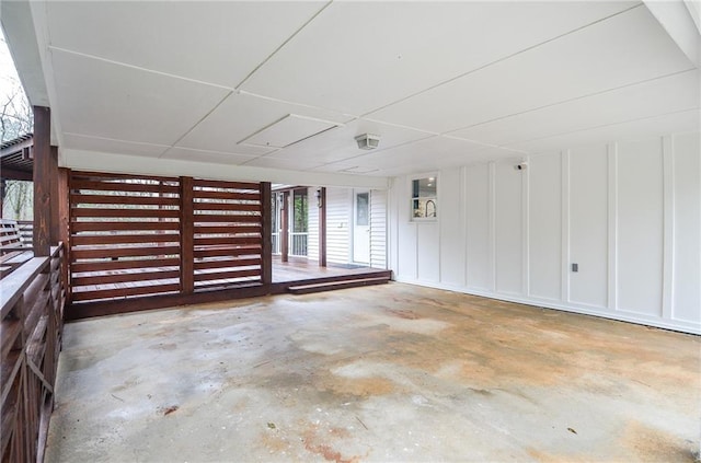 970 Winding Creek Trl, Sandy Springs, GA 30328 - spare room featuring unfinished concrete flooring and a decorative wall