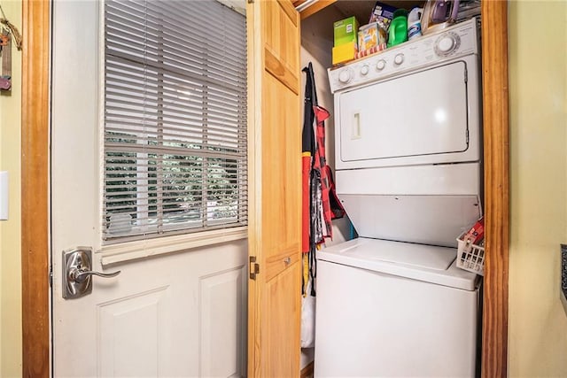 1700 Greenfield Rd, Ellijay, GA 30536 - laundry room featuring stacked washing maching and dryer and laundry area