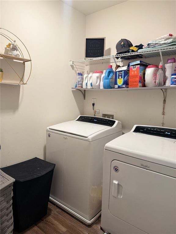 washroom with dark hardwood / wood-style floors and independent washer and dryer