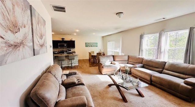 living room with light hardwood / wood-style flooring