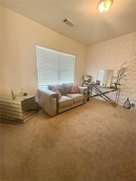 unfurnished living room featuring carpet