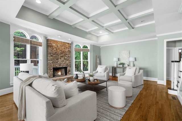 745 Glengate Pl, Atlanta, GA 30328 - living area featuring wood finished floors, coffered ceiling, a stone fireplace, beam ceiling, and ornamental molding