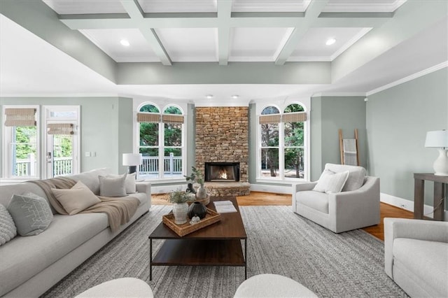 745 Glengate Pl, Atlanta, GA 30328 - living room with coffered ceiling, wood finished floors, beam ceiling, recessed lighting, and a stone fireplace